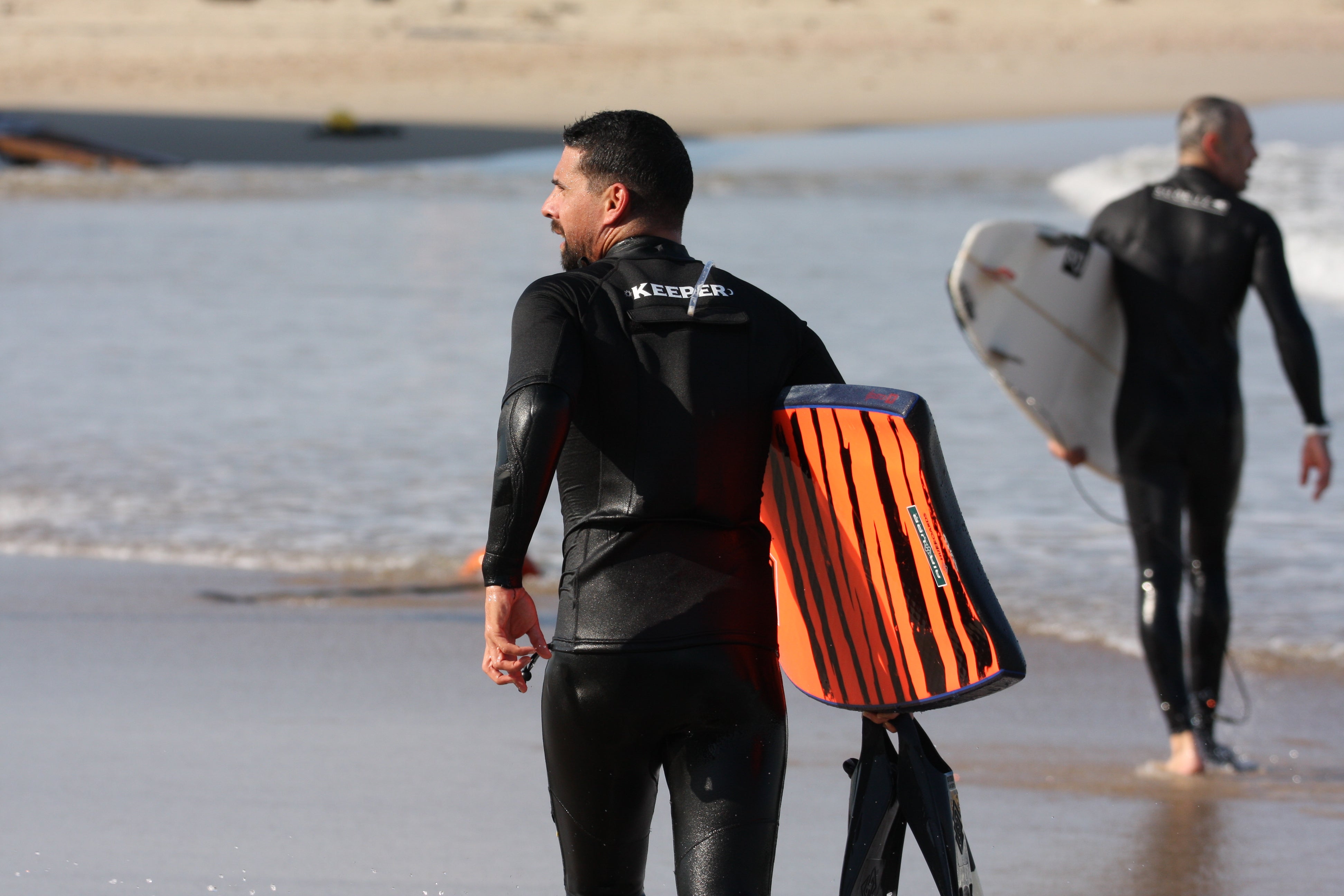 KEEPER rash guard lifestyle beach photo